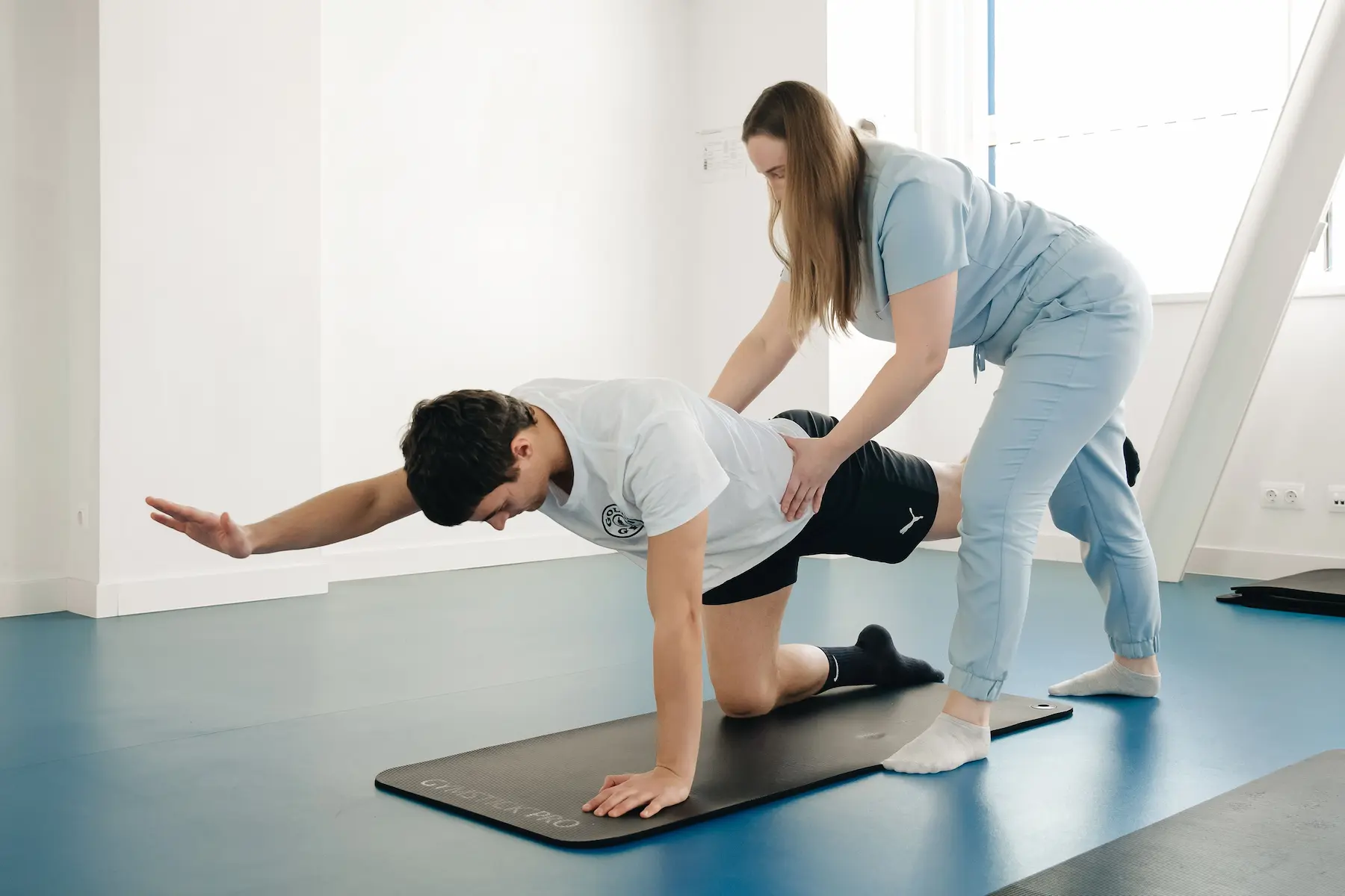 Pelvic floor physiotherapist guiding a patient through a rehabilitation exercise in Ottawa